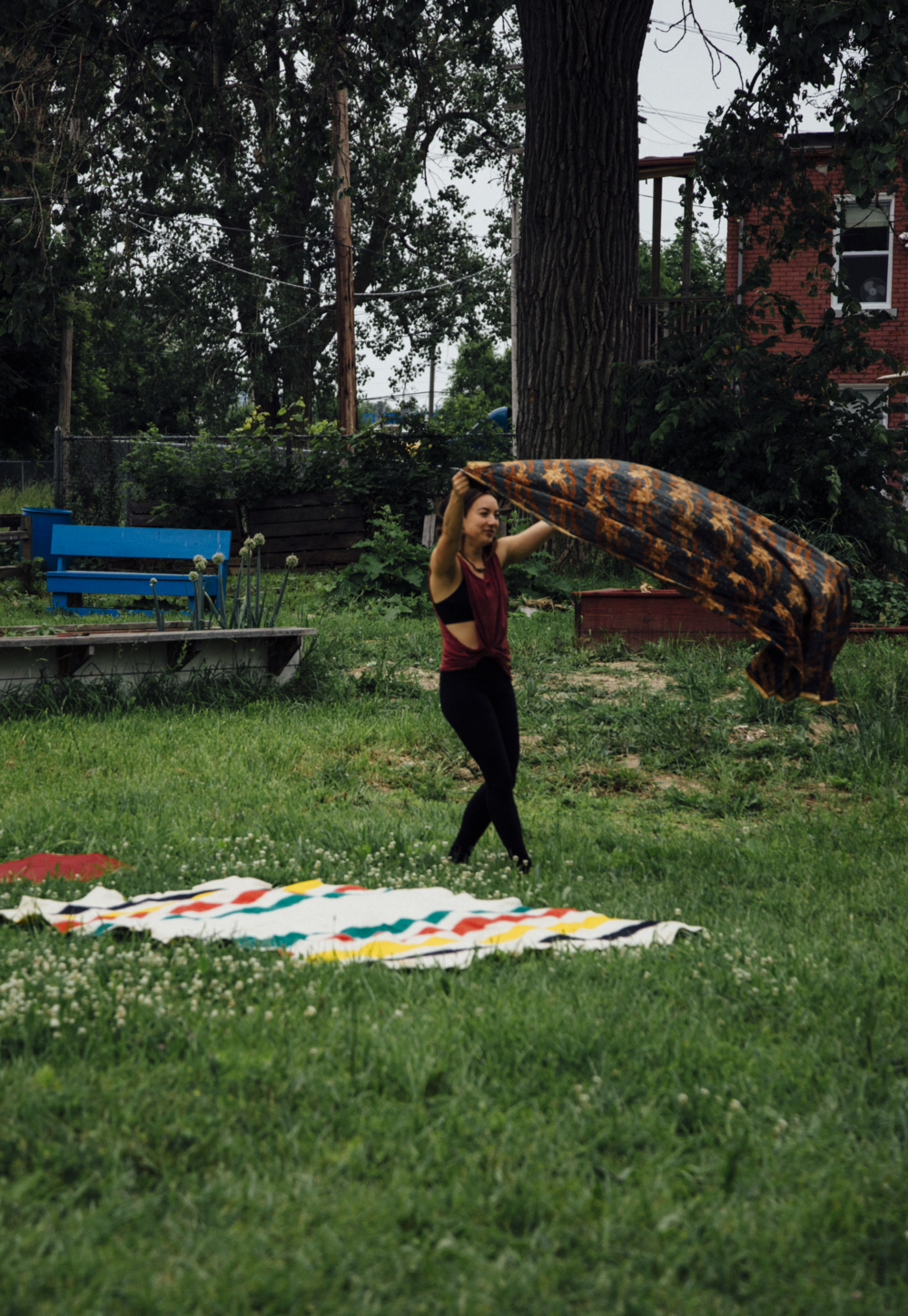 Monica LaFlamme, setting up blankets for the acro-yoga group. &nbsp; &nbsp; &nbsp; &nbsp; &nbsp; &nbsp; &nbsp; &nbsp; &nbsp; &nbsp; &nbsp; &nbsp; &nbsp; &nbsp;photo: ee berger